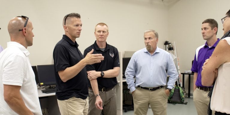 A group from the Air Force 724th Special Tactics Group discusses possible research collaboration opportunities with researchers from East Carolina University’s Human Movement Analysis Lab during a tour on July 23. The group visited several ECU Health and Human Performance and Physical Therapy laboratories to examine assets that could help support their airmen and medical staff.