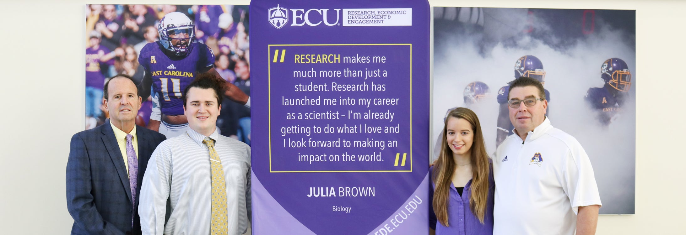 ECU is promoting the growth and success of student research activities at all of our campuses. Pictured above celebrating biology student researcher and cross country runner Julia Brown (center right) are Dr. Jay Golden (from left), Brown’s research partner Matthew Chilton, and Men’s and Women’s Cross Country Director Curt Kraft. (Photos by Matt Smith)