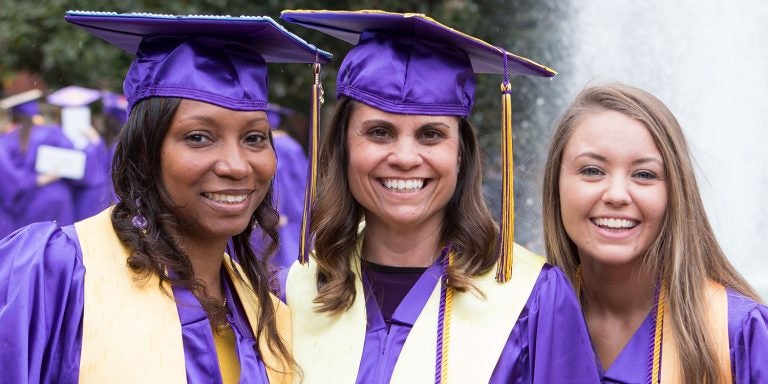 East Carolina University College of Education graduates celebrate after receiving their diplomas. The college's Partnership East program was highlighted for its innovative workforce development strategy by the Association of Public and Land-grant Universities. (Photos courtesy of ECU College of Education)